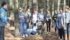 Magdalena Melnychuk, above, of the Balmoral 4-H Club in Manitoba pretends to have to swing across water to survive and, left, navigate a crowded log in exercises to learn how to work together. | Karen Morrison photo