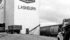 Charles Townley-Smith and Greg Cressman wait their turn to deliver grain at the Saskatchewan Wheat Pool elevator in Lashburn, Sask.,
in this undated photo. | File photo