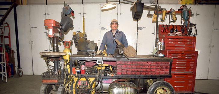 Glen Wasmuth’s portable workbench has everything from grinders and clamps to a cutting torch, drill press and welder. He says it is possible for him to move it on concrete, but he uses a quad to move it across the yard.  |  William DeKay photo