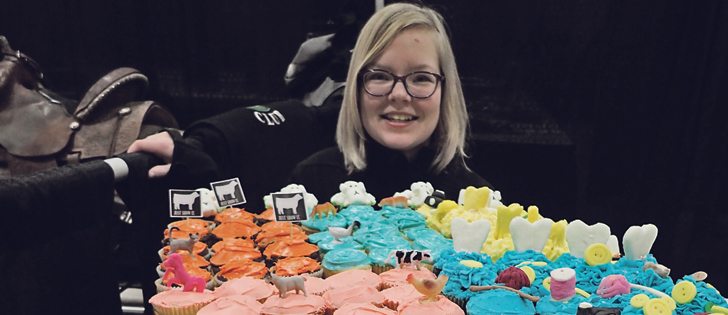 There were 100 cupcakes to mark 100 years of 4-H in Alberta during a Jan. 7 celebration among 4-H clubs in Lethbridge. Ruth Sprague of the Brooks and Area 4-H Multi Club stands behind the treats. | Barb Glen photo