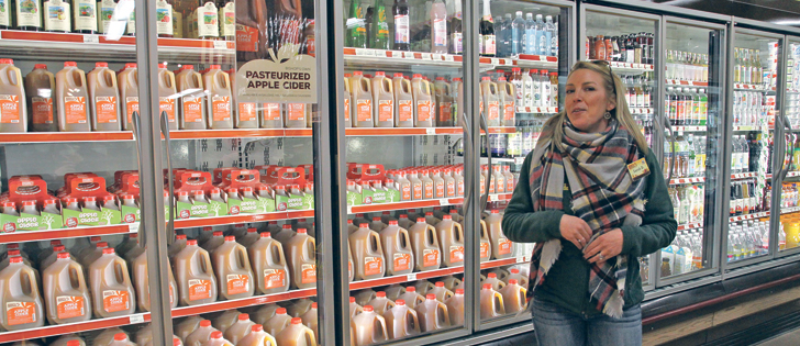 Sarah DellaVentura shows North American Farmers’ Direct Marketing Association visitors the assortment of value-added products that Bishop’s Orchards offers customers in Guilford, Conn.  |  Karen Morrison photo