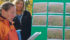 Catherine Tarasoff of Agrowest Consulting, left, and British Columbia Forage Council manager Sheri Schweb explain photos of farmer Jon Solecki’s forage trial results near Grassy Plains, B.C. The trials were part of a research project initiated by the council and the B.C. agriculture ministry. | Chris Yates photo