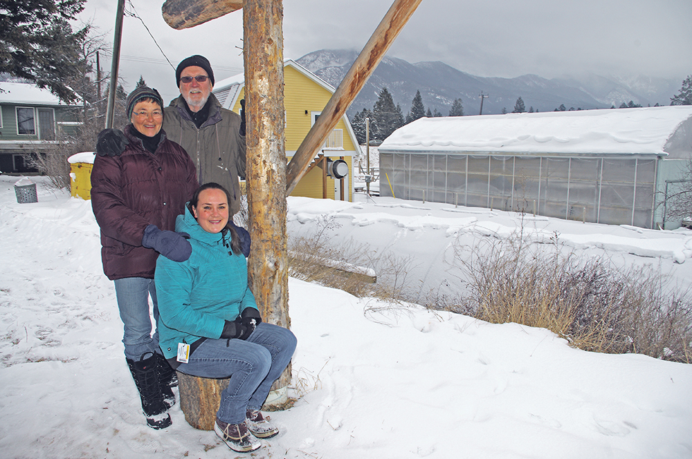 Anna Steedman, seated, and her parents, Glenda Wah and Jack Steedman, pose outside their greenhouse and catering business at Windermere, B.C.  |  Karen Morrison photo