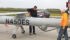 John Nowatzki, right, watches as a Hermes 450 surveillance drone is fuelled up for a trip over North Dakota fields that may yield up to 50,000 acres of high resolution imagery for every hour of flight. | North Dakota State University photo