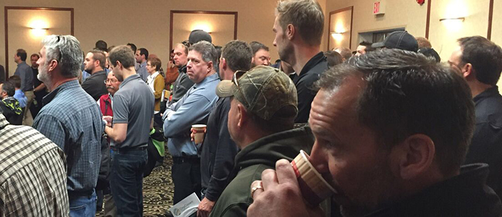 A crowd of more than 100 farmers wait for a presenter at CropConnect in Winnipeg. | Ed White photo