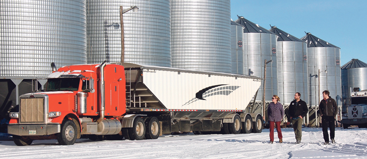 Windy Poplars Farms Ltd. purchases inputs and equipment together. Six semi trucks are part of the operation.   |  Christalee Froese photo