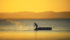 A fisherman casts his net early in the morning at Lake Nicaragua. | Arlene & Robin Karpan photo