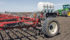Marrying the 80-foot harrow to the 4,200 U.S. gallon caddy, and pulling the big rig at eight m.p.h., reduced machine time by 40 percent in an operation that combined fertilizer application and seedbed preparation. | Elmer’s Manufacturing photo