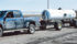 Without trailer brakes and having a wagon-style fifth wheel steering on both wagons, this setup is not allowed in Manitoba, where it was seen. Both brakes and hitching systems are not designed to be used universally behind any machine with a hitch, such as this pickup. | Glenn Dickson photo