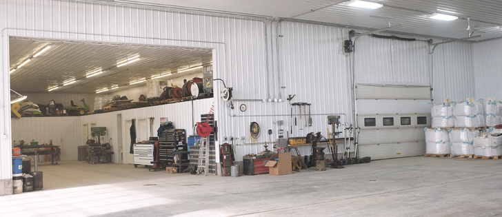 The older shop, on the left, is a work area where tools are kept and where the office, lunchroom, bathrooms and mechanical room are located. Behind the large door on the right of the picture is where two storage trailers are located.  | Lisa Klassen photo