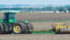 Getting ready to roll: Jaydan Walter checks his equipment before rolling Bob Fraser’s barley field south of High River, Alta. | Mike Sturk photo