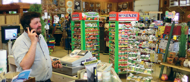 Brad Friesen takes a phone call while at the counter of the garden centre that is part of his Dunvegan Gardens business in Fort McMurray. Friesen owns sheep, chickens and pigs and has been told by the city a licence is required.  |  Barb Glen photo 