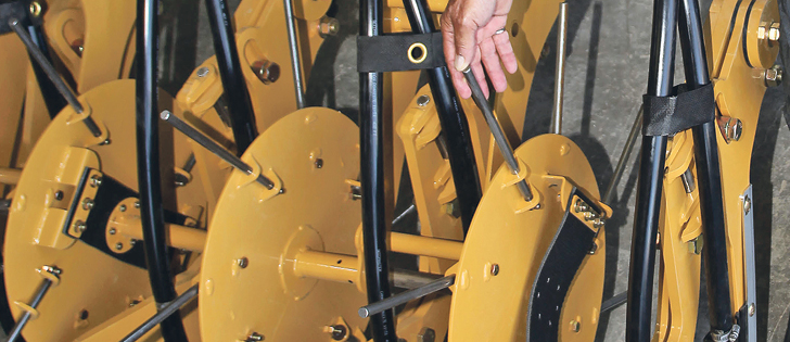 SeedMaster's latest innovation, a residue removal tool that runs between a single rank of shanks on an air drill.  |  Michael Raine photo