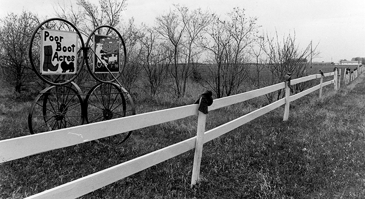 Old boots topped a kilometre of fence posts at Poor Boot Acres north of Martensville, Sask., in the spring of 1984.  |  File photo