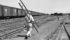 A federal grain inspector moved toward a Canadian National Railway grain train in Winnipeg to draw samples for grading in this undated photo. | File photo
