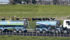 A Fonterra milk tanker drives past dairy cows as it arrives at Fonterra’s Te Rapa plant near Hamilton, New Zealand, in 2013. New Zealand is a major player in the global dairy trade. | REUTERS/Nigel Marple File Photo