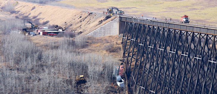 A 13-car train derailed at the Fabyan Trestle Bridge west of Wainright Tuesday evening, sending some cars plummeting nearly 60 metres  |  Jeremy Simes photo