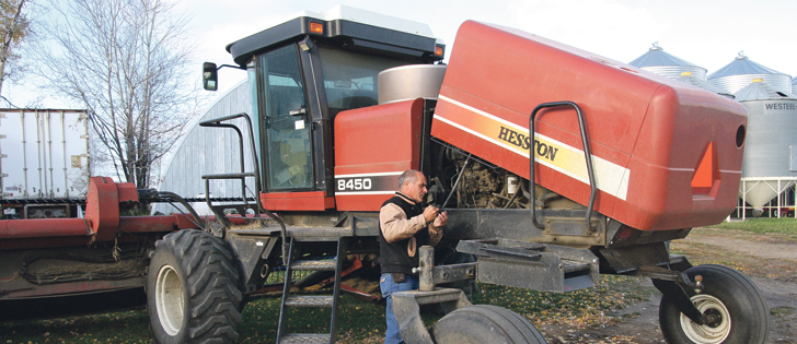 Ken Stasiuk makes sure his equipment is ready for the remaining harvest. He and his wife, Connie, operate a farm near Rochester, Alta. |  Karen Morrison photo