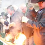 From left, Tracy Fahlman, CEO of Regina Hotels Association, Regina mayor Michael Fougere, Saskatchewan agriculture minister Lyle Stewart and Canadian Western Agribition president Bruce Holmquist burn the brand to open the 2017 show and celebrate the opening of the International Business Centre. | Karen Briere photo
