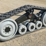 Camso has reduced maintenance on its TTS series of tow tracks by using oil bath hubs instead of greaseable bearings. | File photo