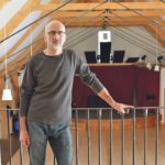 Lance Cornock stands inside the new community hall in Demmit, Alta. He says the building, valued at $1 million more than it cost to build, is the culmination of private and public fundraising efforts and volunteer labour. | Jeremy Simes photos