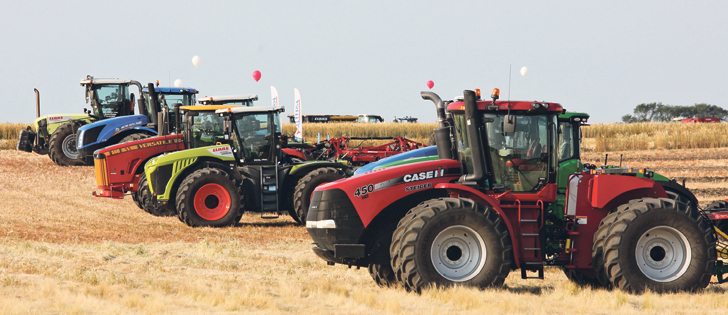 At the Ag In Motion show site near Langham, Sask., high-powered tractors are lined up for the daily field demonstrations. The 2017 show had tillage, combines and the DOT Technologies autonomous field tool.  |  Michael Raine photo