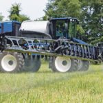 The SP310F, New Holland’s latest Guardian front boom sprayer, comes with a 310 horsepower FPT engine and an optional injection system with four 50 gallon tanks with three chemical injection pumps that provide for variable rate or spot spraying. | New Holland photo