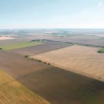 Lower commodity prices and tighter margins are expected to take their toll on farmland prices in the United States. | File photo