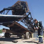 MacDon’s history of providing rugged and unique harvest tools for small grains and oilseeds producers stretches back through modern agriculture’s history. Products like this 972 draper header being updated at Rocky Mountain Equipment in Oyen, Alta., are good examples of long-term reliability of brand. | File photo