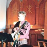 Christmas carols accompanied by a guitar played by Pastor Daniel Jefferies were sung for the congregation at a Christmas candle light service held in the Mirror, Alta., church. | Duane McCartney photo