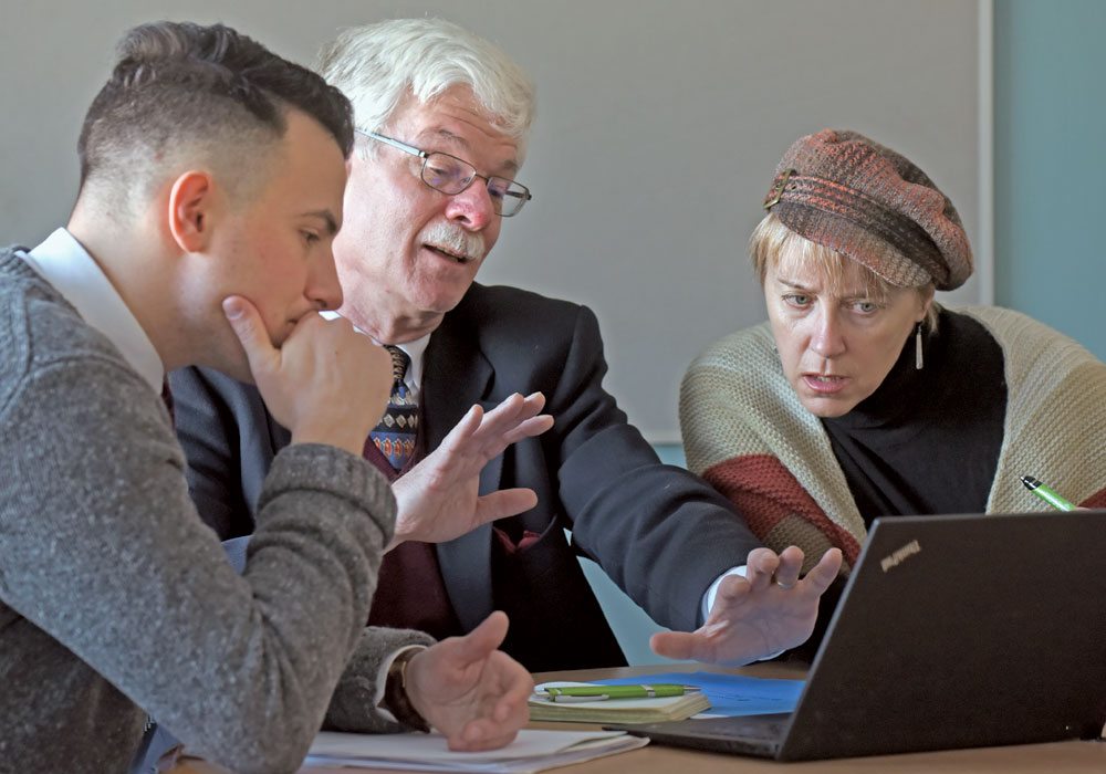 Graeme Jobe, left, and Jo-Anne Relf-Eckstein, far right, are part of a University of Saskatchewan team headed by principal investigator Peter Phillips, middle, that is focused on identifying the opportunities and barriers for digital technology and agriculture for Western Canada from a policy perspective.  |  William DeKay photo