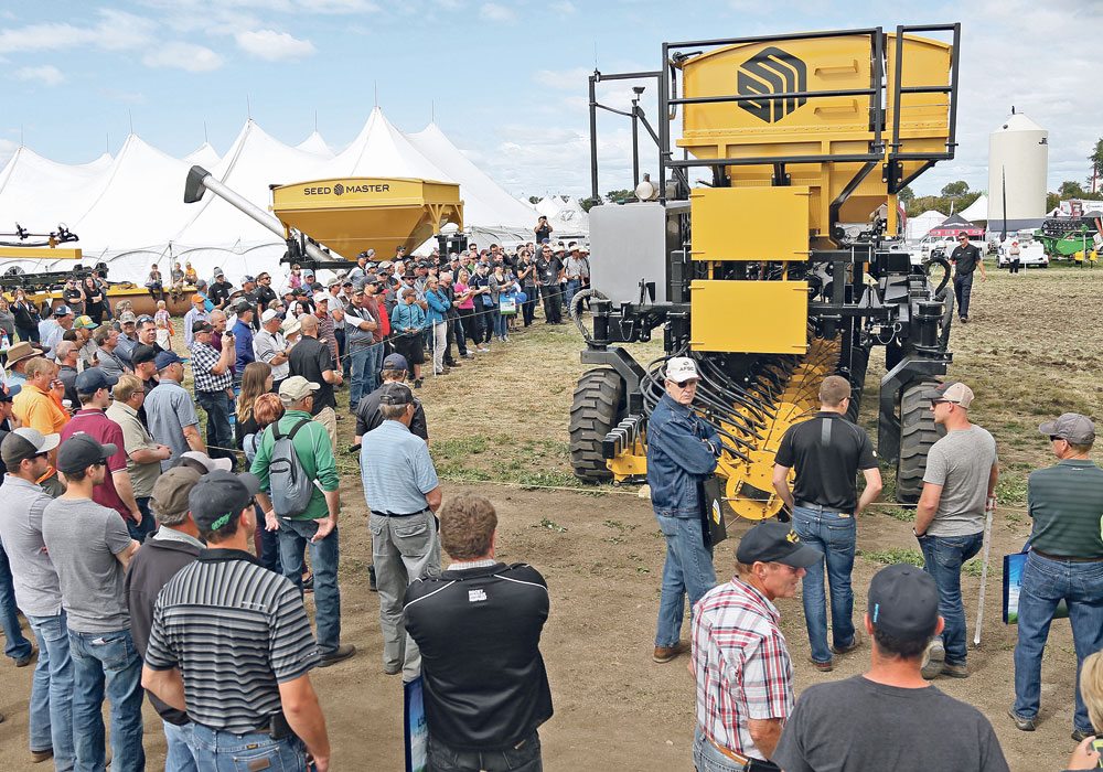 In a recent technology survey, 75 percent of farmers asked said they wouldn’t be ready to adopt autonomous vehicles on their farms for at least three to five more years. Few said the technology was a high priority for them. These farmers got a close look at one such machine, the DOT autonomous field platform, at the 2017 Ag in Motion farm show. |  File photo