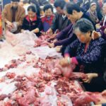 Analysts worry that China’s demand for food will decrease if population estimates for the country prove correct. Here, shoppers check out the rabbit meat counter at a Walmart in Chongqing in central China in this file photo from 2011. | REUTERS/Terril Yue Jones photo