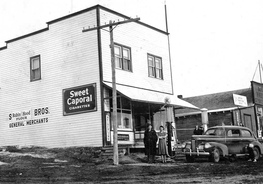 Alf and Thelma Foster stand in front of their store sometime in the 1940s. They bought the store in 1939 and eventually added a Cockshutt farm equipment agency. They renovated the second floor living quarters and lived there during their time in Benalto. The Fosters sold the store in the mid 1940s.  |  
Jim Foster photo