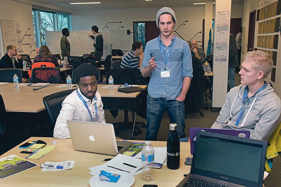 Kulani Zwane, left, Eric Tetland and Ben Lewis comprised one of the four teams participating in this year’s hackathon in Saskatoon. They won the competition with an idea they called CropShot.  |  William DeKay photo