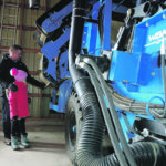 Tom and Cate check ginseng harvest equipment stored in the drive shed for the winter. | Sharon Grose photo