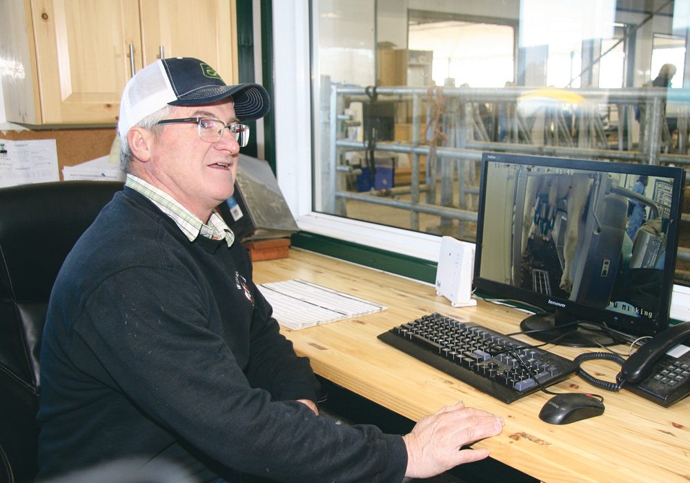 Ken Wilkes can watch all the activities in his dairy barn from the comfort of his office. The computer also tells him which cows are at the robotic milker and can provide production information. He says milking cows has never been easier since he and his wife, Peggy, installed a robotic milker on their Ontario farm.  |  Barbara Duckworth photo
