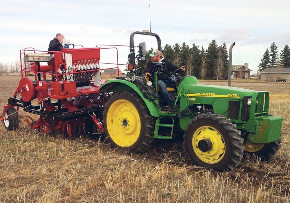 Seeding the Agriculture Canada plots at Lethbridge when the soil temperature was 0 C on Feb. 16, 2016, was a cold affair.  |  Ryan Dyck photo