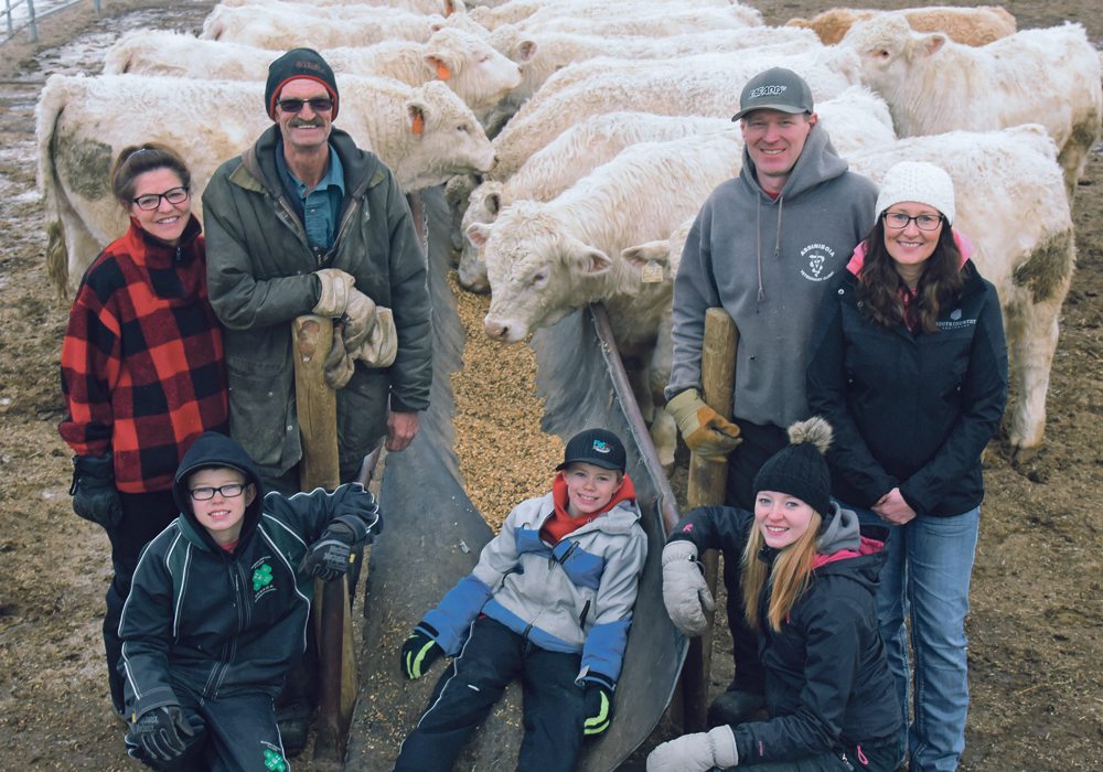 The Elder family poses with some of their purebred Charolais. Sitting are Keanan, left, 12, Klay, 9 and Cassidi, 14. Standing are Donna, left, Ron, Mike and Judy.  |  William DeKay photo
