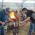 Jason Wrubleski and Greg Toronchuk work together to forge a regular horseshoe and a therapeutic horseshoe in the two-man, 45-minute event. In this instance, Wrubleski is the main man and Toronchuk his helper. They later reversed their roles for the second two-man event. | Les Dunford photo