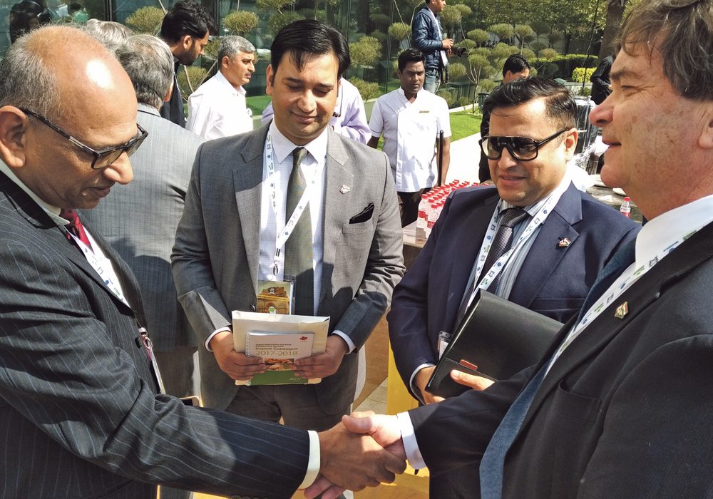 Alberta Agriculture Minister Oneil Carlier, right, meets with representatives from the India Pulse and Grain Association and Alberta’s New Delhi office at the 2018 Pulse Conclave.  |  Gov’t of Alberta photo