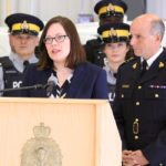 Justice minister Kathleen Ganley stands next to Todd Shean, deputy commissioner with the Alberta RCMP. Ganley announced new funds to help fight rural crime. | Jeremy Simes photo