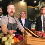 Blair Lebsack, chef of the Rge Rd restaurant in Edmonton, shows Agriculture Minister Oneil Carlier (right), producer Jason Andersen (centre) and MLA David Shepherd food his restaurant prepares with local ingredients. | Jeremy Simes photo