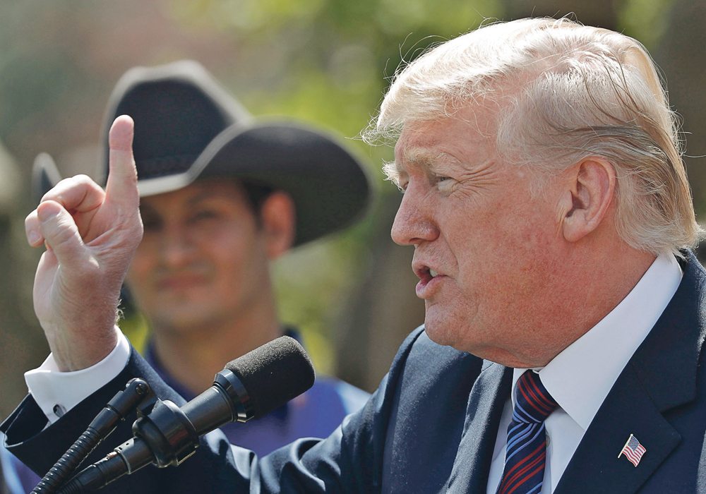 U.S. President Donald Trump has kept the trade rhetoric rolling, but with so many pots on the fire, might Canadian trade be forgotten?  |  REUTERS/Carlos Barria photo