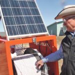 Rancher Norm Ward developed an automated fencing system to help him divide up pasture paddocks quickly and efficiently. The trailer carries fence posts, special fencing rope, tools and a solar panel. | Barbara Duckworth photo
