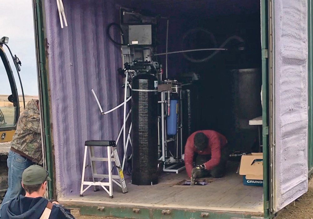 Brian Tennant said the hardest part of developing his new Dugouts to RO system was to get the particulate size below five microns before the water hit the reverse osmosis membrane. The water treatment apparatus is available in an insulated self-contained steel structure, shown here, or can be installed in any existing building.  |  Ron Lyseng photo
