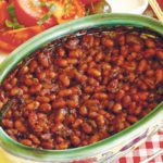 Nothing says barbecue season like smoky baked beans, loaded baked potato salad and garlic bread, tomato salad and green onion and asparagus salad. | Sarah Galvin photo