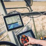 The Lexion is showing a JD display and the JD machinesync feature. The lighter blue area depicts a European-built S680 coverage working in the same field as the Lexion, depicted with the deeper blue. Data exchange is handled with JD modems. This is the first bridge Heupel released to the market in 2015. Agra GPS photos
