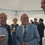 There were lots of smiles and congratulations at the celebration for the signing of Bill C-49. Here Art Enns, Grain Growers of Canada Vice President, left, and Ralph Eichler, centre, are in good moods after lauding the legislative achievement in official remarks at an event held outside Winnipeg at a Richardson elevator. | Ed White photo