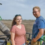 Jadeene and Rolin Wolfe take a break from seeding. | Les Dunford photo